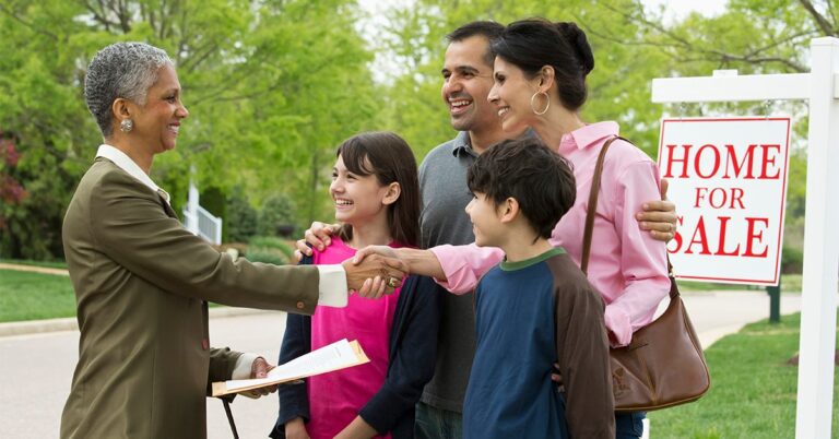 family shaking hands with real estate agent GettyImages 463245077 1200w 628h