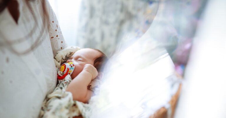 sleeping newborn girl in