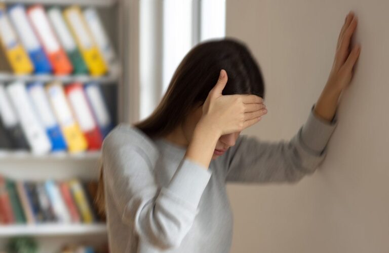 woman holding head