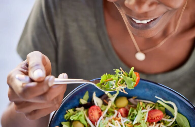 woman eating salad